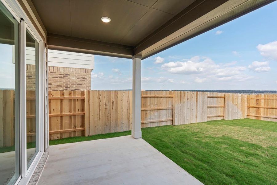 Exterior details and patio area of a home in Lariat, Liberty Hill (Image 26).