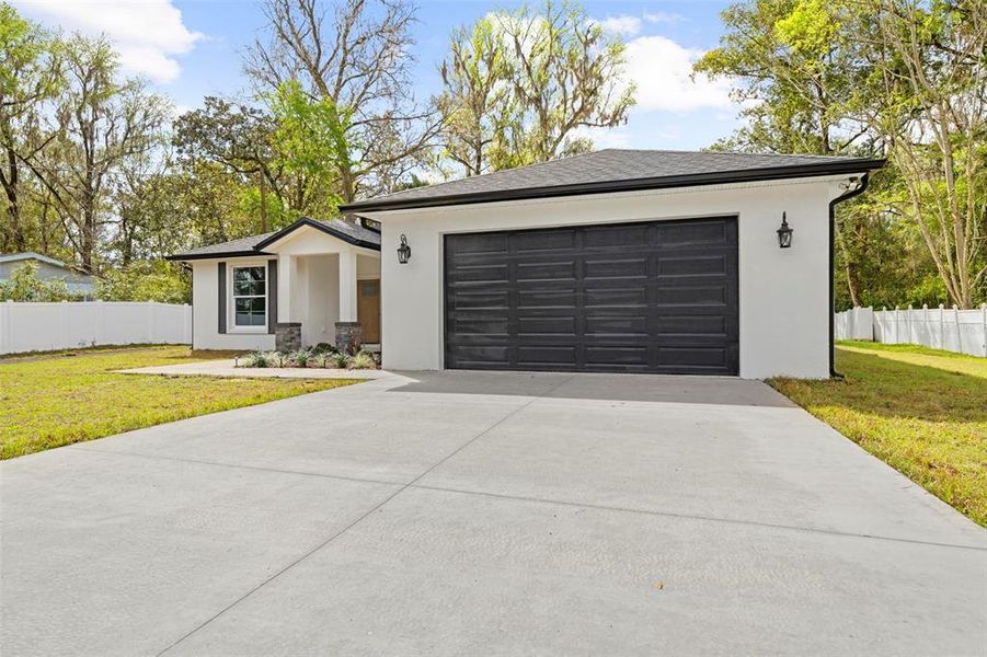 Front exterior of a new home in , Brooksville, FL, highlighting curb appeal (Image 21).