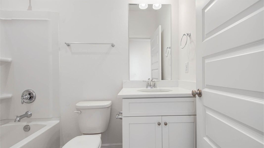 Representative furnished interior of a home built from the Kennedy by D.R. Horton in Bayside at Ward Creek, Panama City Beach (Image 18).