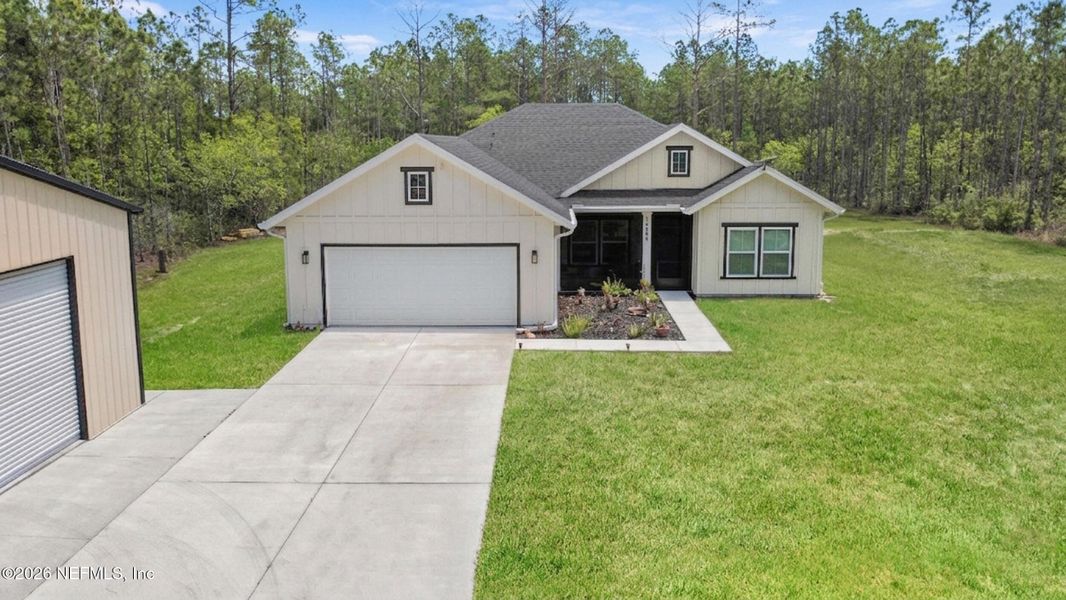 Front exterior of a new home in , Hastings, FL, highlighting curb appeal (Image 24).