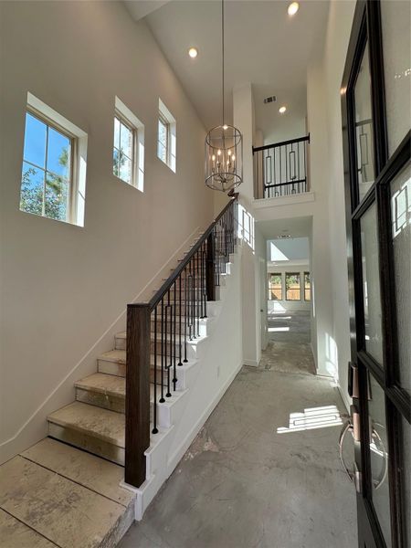Step inside a grand entryway, with soaring ceilings and a graceful staircase that creates a welcoming sense of space and light from the moment you arrive. Step inside a grand entryway, with soaring ceilings and a graceful staircase that creates a welcoming sense of space and light from the moment you arrive.