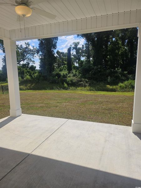View of patio featuring ceiling fan