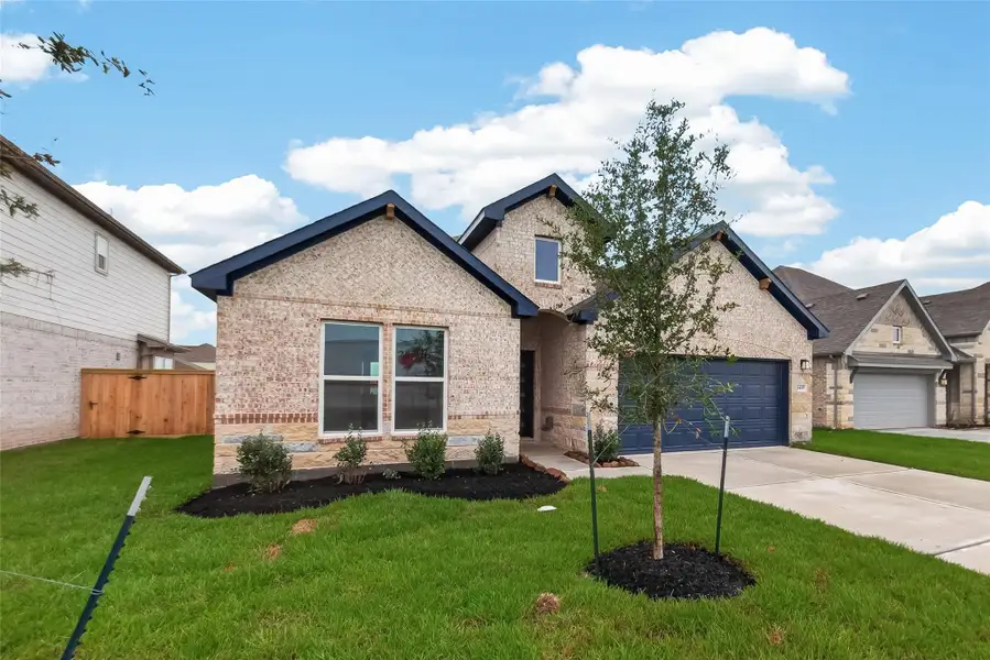 Front exterior of a new home in Foxtail Palms, Manvel, TX, highlighting curb appeal (Image 23). Front exterior of a new home in Foxtail Palms, Manvel, TX, highlighting curb appeal (Image 23).