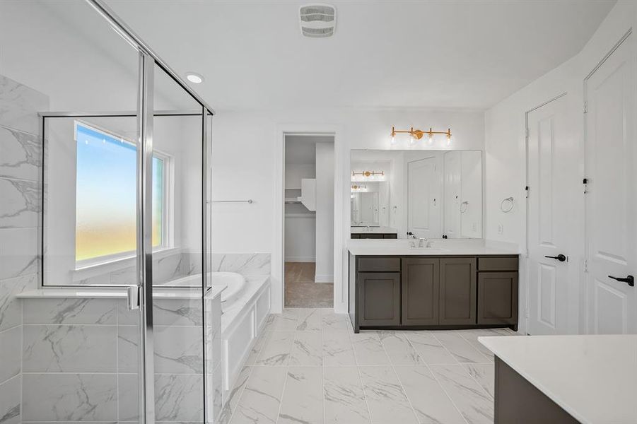 Full bath with a marble finish shower, a bath, vanity, light marble finish flooring, and recessed lighting