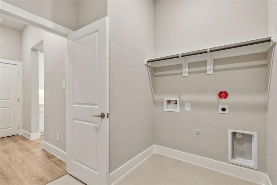 Laundry area featuring hookup for a gas dryer, washer hookup, and hookup for an electric dryer