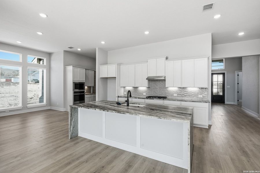 Furnished interior view inside a new home in Potranco Oaks, Castroville (Image 15).