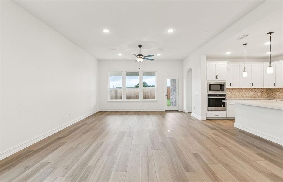 Sunlit gathering room designed for relaxation and entertainment  *Real home pictured