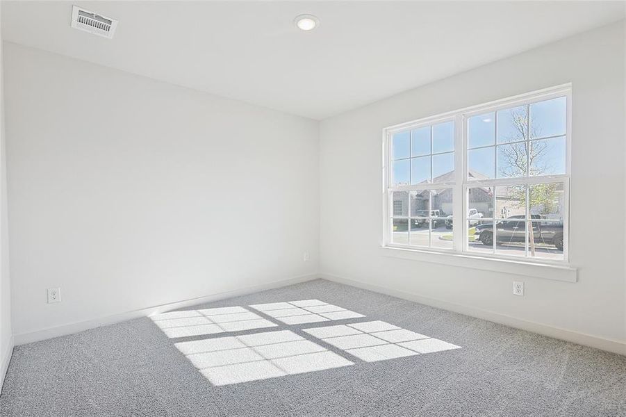 Unfurnished room with carpet