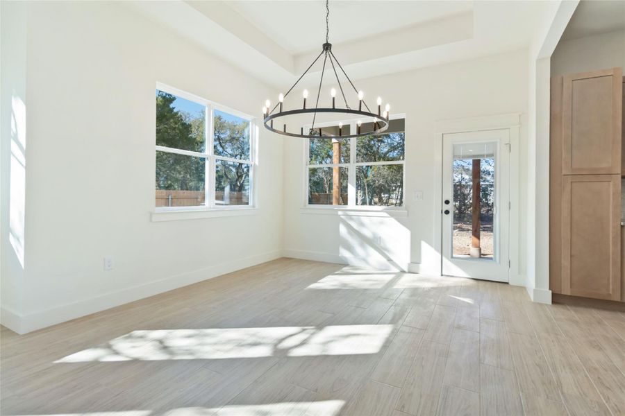 Dining area with views of covered patio. Without virtual staging Dining area with views of covered patio. Without virtual staging