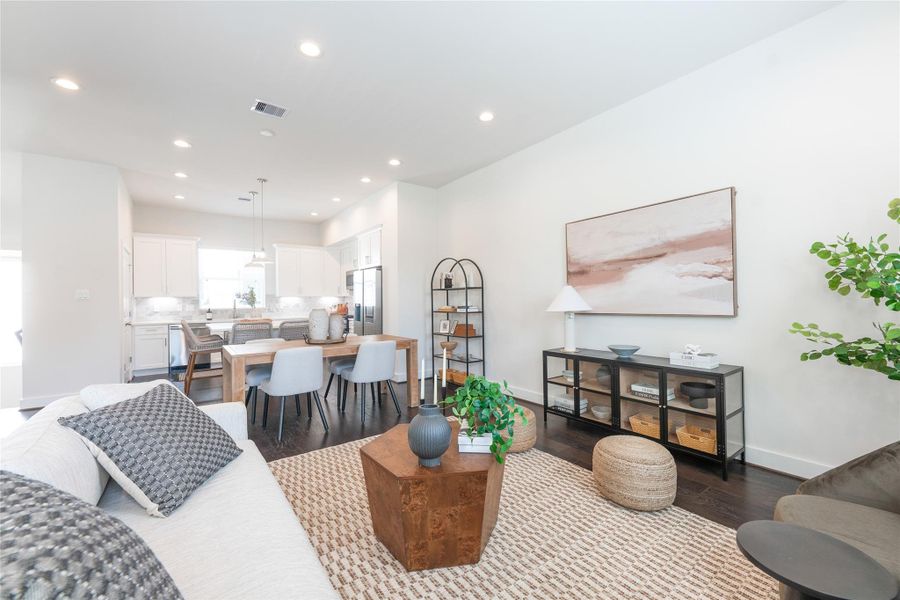 Another view of the open-concept living area with modern design, abundant natural light, and seamless flow into the kitchen. Perfect for entertaining and relaxation.