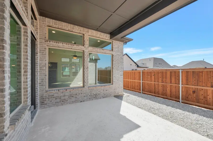 Exterior details and patio area of a home in Elements at Viridian - Garden Series, Arlington (Image 4). Exterior details and patio area of a home in Elements at Viridian - Garden Series, Arlington (Image 4).