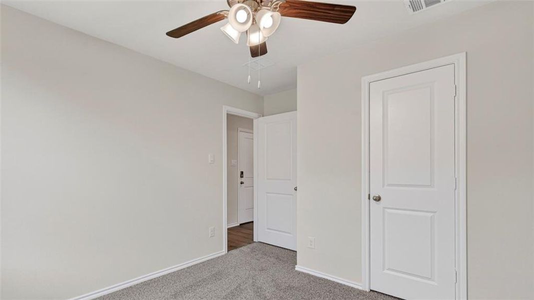 Neutral gray wall finishes complementing a gray carpeted floor Neutral gray wall finishes complementing a gray carpeted floor