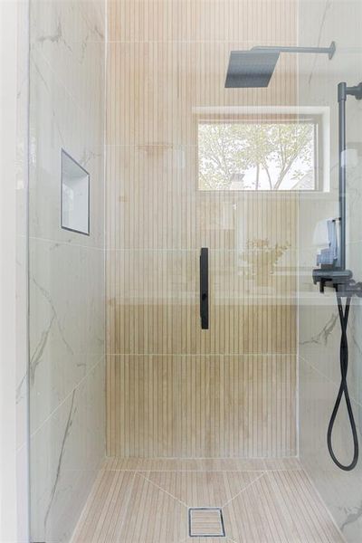 Bathroom with tiled shower