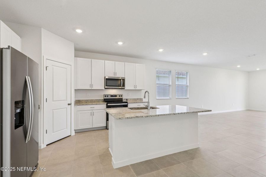 Furnished interior view inside a new home in Lakes at Bella Lago - Signature Series, Green Cove Springs (Image 11). Furnished interior view inside a new home in Lakes at Bella Lago - Signature Series, Green Cove Springs (Image 11).