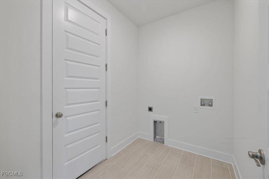 Laundry area with washer hookup and electric dryer hookup
