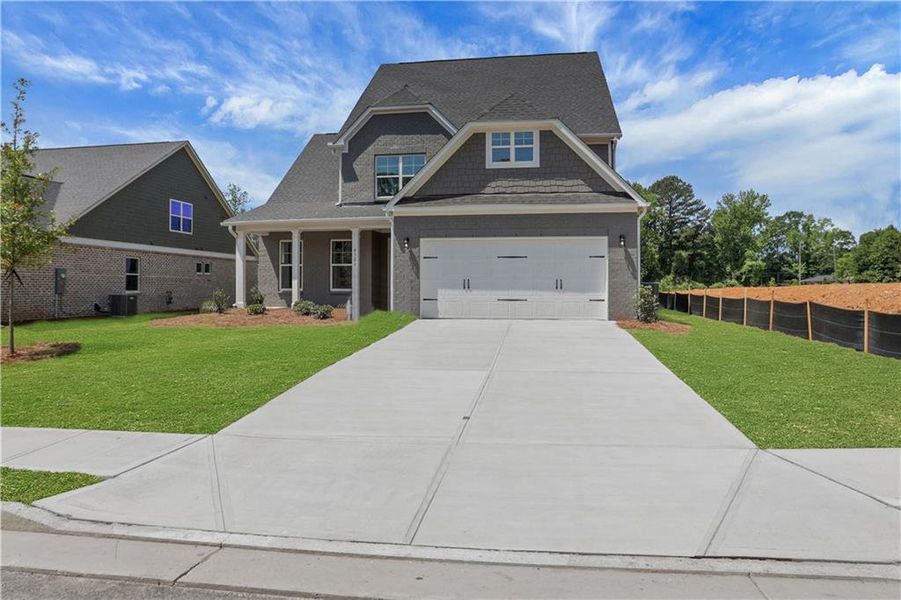 Front exterior of a new home in , Loganville, GA, highlighting curb appeal (Image 26). Front exterior of a new home in , Loganville, GA, highlighting curb appeal (Image 26).