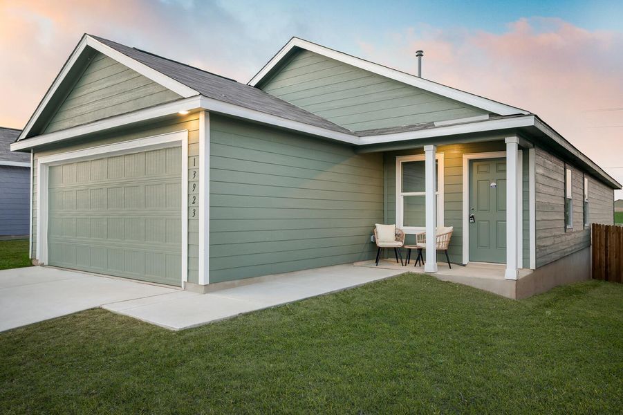 View of front facade with a garage, driveway, and a porch View of front facade with a garage, driveway, and a porch