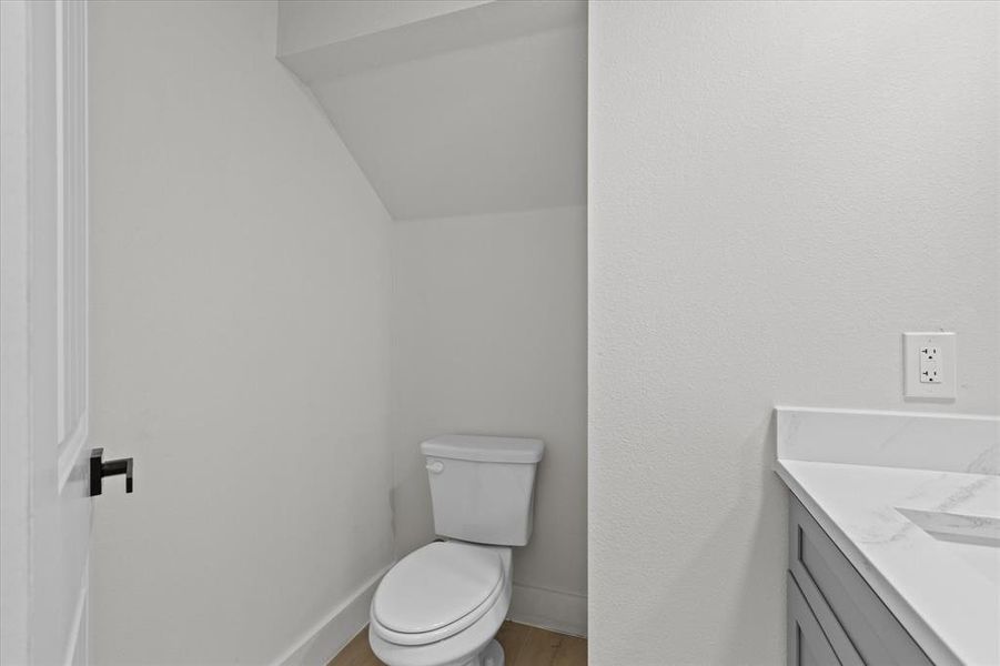 Bathroom featuring vanity and wood finished floors