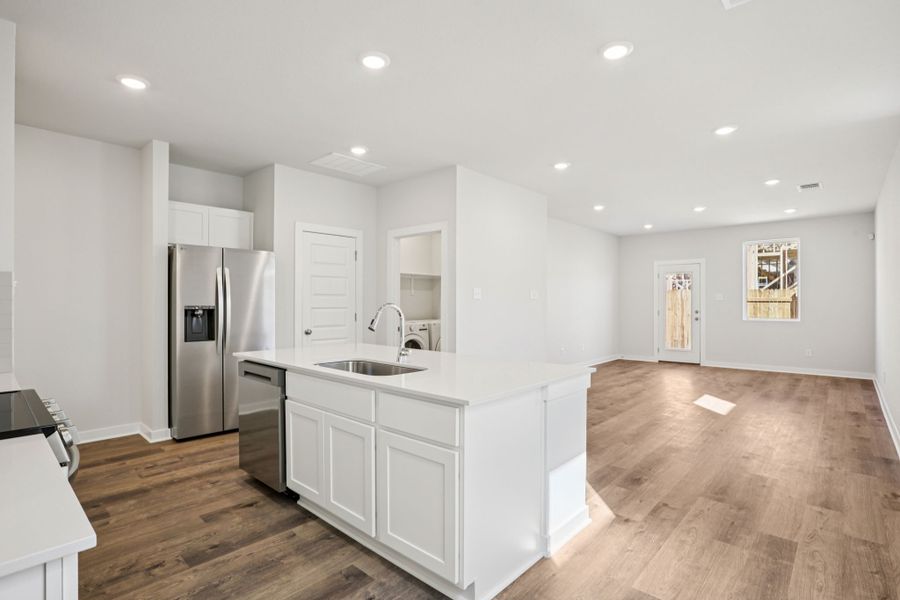 A kitchen with white cabinets. A kitchen with white cabinets.