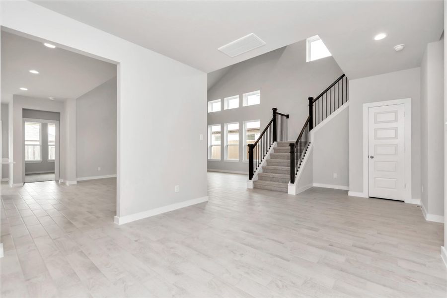 An inviting dining space seamlessly woven into the open concept, connecting the family room and kitchen. Revel in the stunning floors & soothing paint palette – a perfect setting for shared meals and cherished moments. Sample photo of completed home with similar floor plan. As-built interior colors and selections may vary An inviting dining space seamlessly woven into the open concept, connecting the family room and kitchen. Revel in the stunning floors & soothing paint palette – a perfect setting for shared meals and cherished moments. Sample photo of completed home with similar floor plan. As-built interior colors and selections may vary