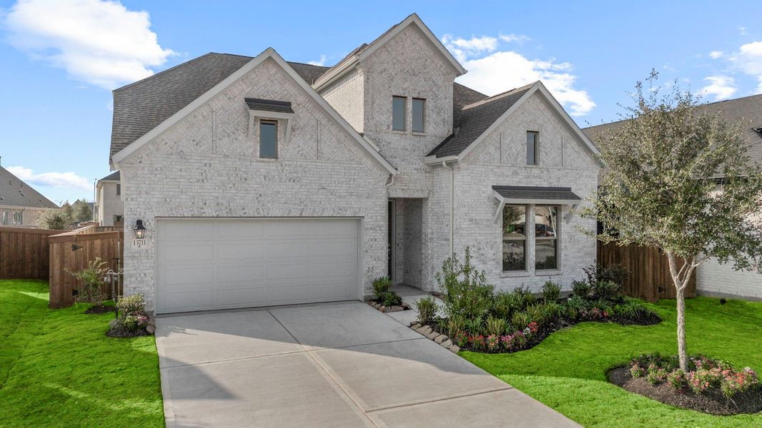 Front exterior of a new home in Dunham Pointe 50', Cypress, TX, highlighting curb appeal (Image 18).