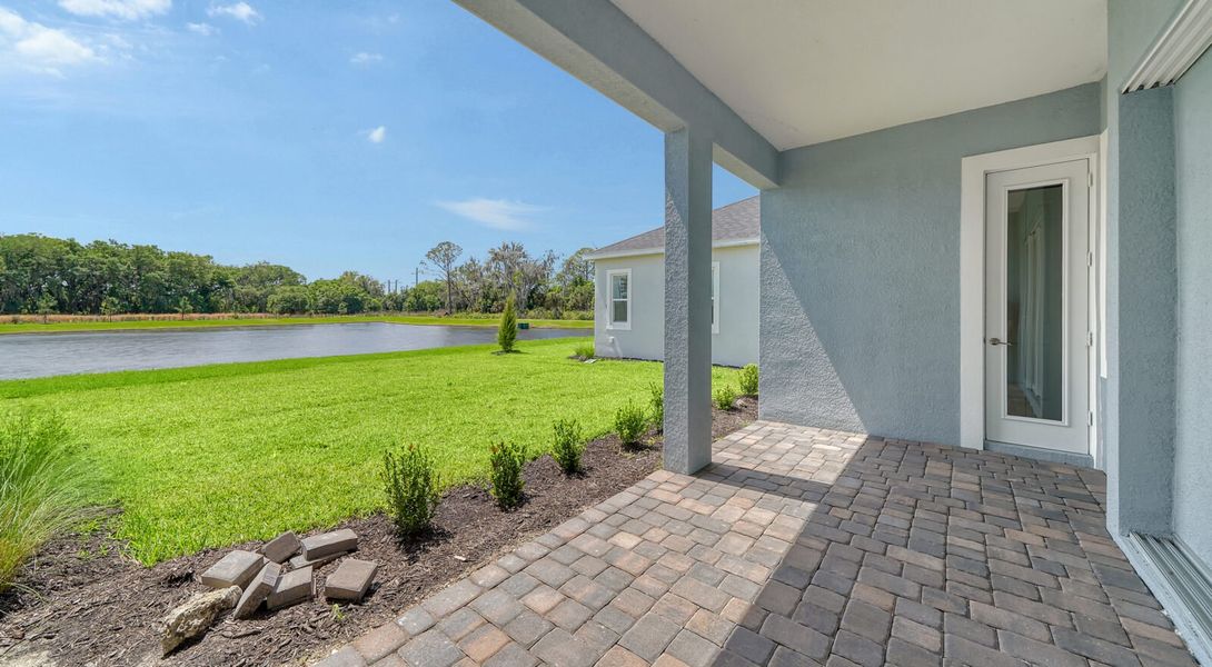Exterior details and patio area of a home in Wildleaf at North River Ranch, Parrish (Image 18).