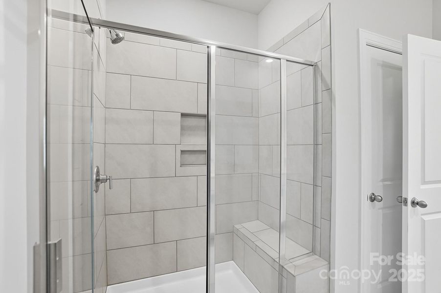 Spacious shower with bench Spacious shower with bench