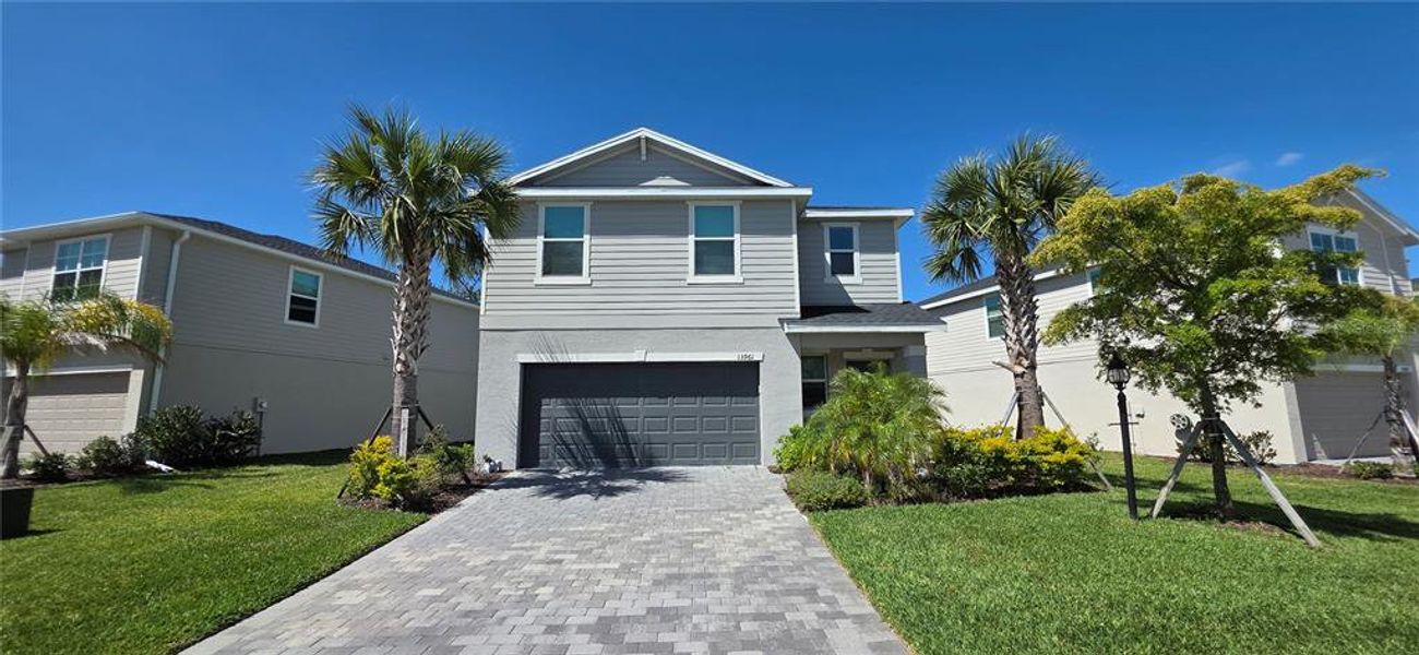 Front exterior of a new home in , Bradenton, FL, highlighting curb appeal (Image 1). Front exterior of a new home in , Bradenton, FL, highlighting curb appeal (Image 1).