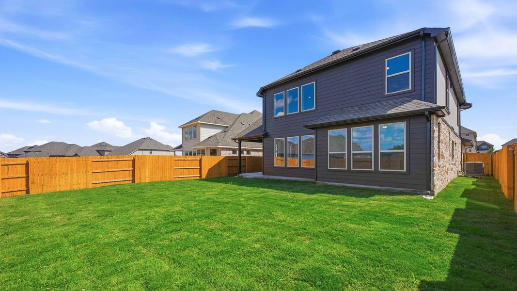 Exterior details and patio area of a home in Oaks at San Gabriel, Georgetown (Image 25).