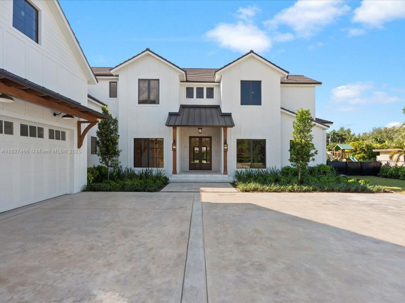 Front exterior of a new home in , Miami, FL, highlighting curb appeal (Image 22).