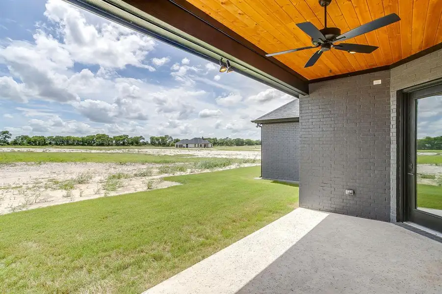 Exterior details and patio area of a home in Peaks at Lone Elm, Waxahachie (Image 24). Exterior details and patio area of a home in Peaks at Lone Elm, Waxahachie (Image 24).