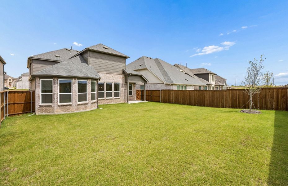 Exterior details and patio area of a home in Creekview Meadows, Pilot Point (Image 2).