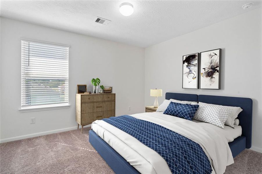 Secondary bedroom features plush carpet, neutral paint, lighting, large window with privacy blinds and ample sized closet space.