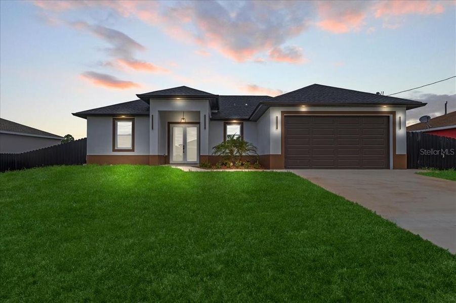 Front exterior of a new home in , Lehigh Acres, FL, highlighting curb appeal (Image 19).