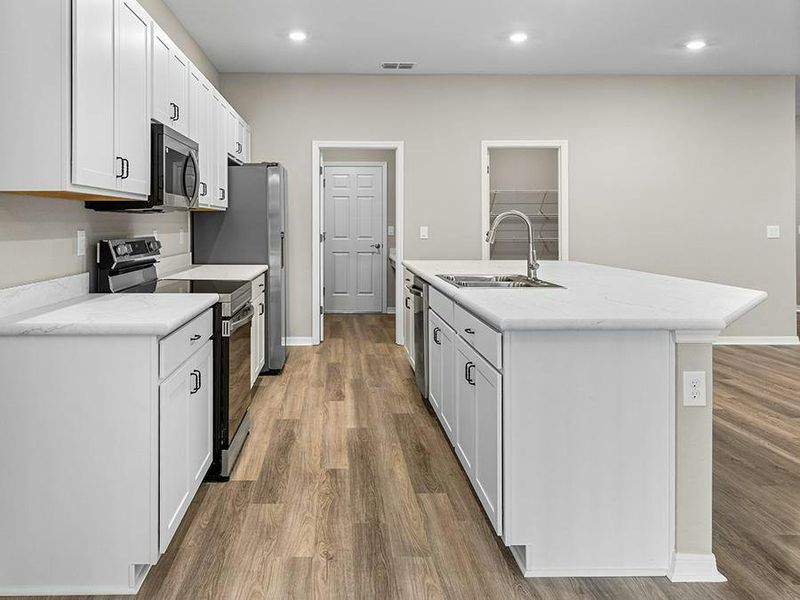 Your new kitchen features 36-inch cabinets, Samsung SS appliances, and a walk-in pantry.