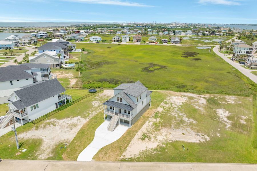 Front exterior of a new home in , Galveston, TX, highlighting curb appeal (Image 23).