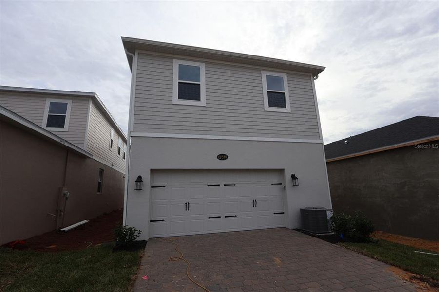 Exterior details and patio area of a home in Lake Star at Ovation, Winter Garden (Image 3).