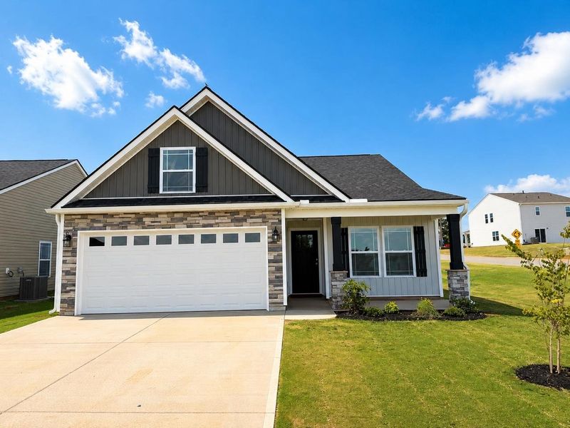 Front exterior of a new home in Cleveland Meadows, Spartanburg, SC, highlighting curb appeal (Image 1). Front exterior of a new home in Cleveland Meadows, Spartanburg, SC, highlighting curb appeal (Image 1).