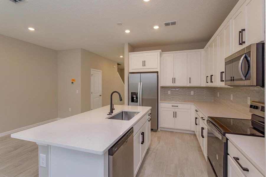 Furnished interior view inside a new home in Serenade at Ovation, Winter Garden (Image 7).
