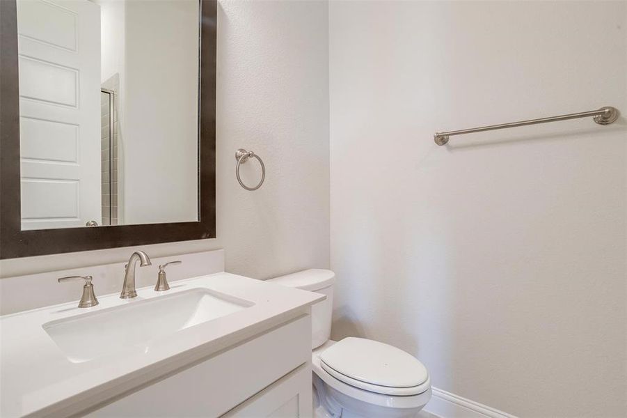 Bathroom featuring vanity and toilet