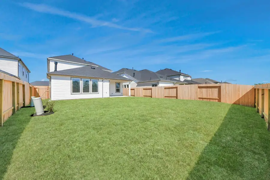 Backyard retreat, offering an abundance of space for kids to play and explore. The possibilities are endless in this outdoor haven, where the joy of open-air activities and family gatherings awaits.