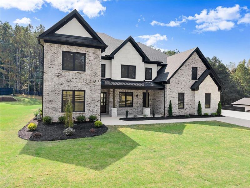 Front exterior of a new home in , Hoschton, GA, highlighting curb appeal (Image 32).