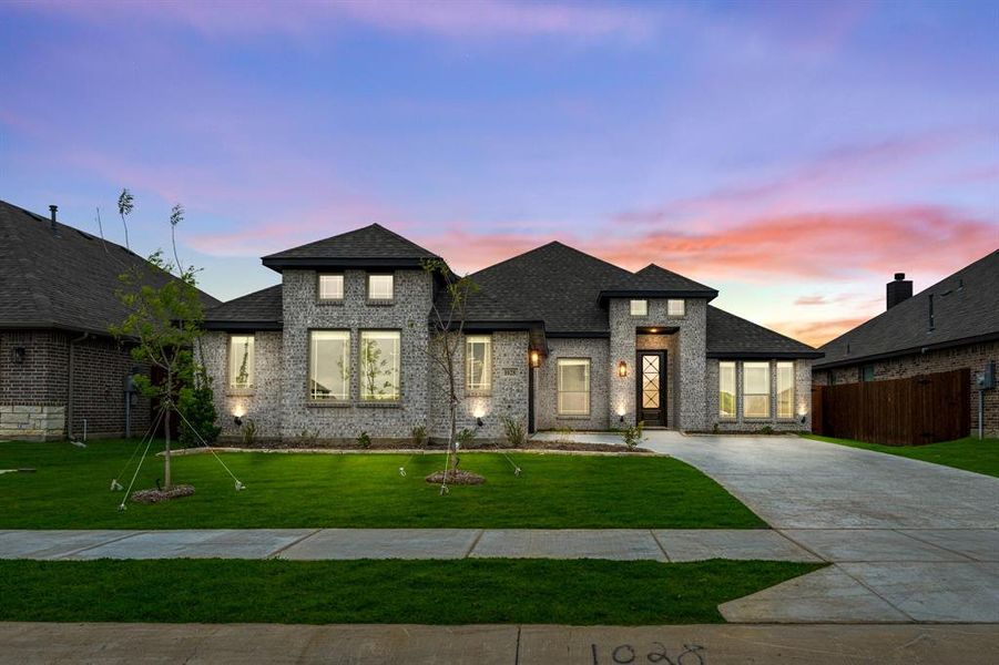 Front exterior of a new home in Star Ranch, Godley, TX, highlighting curb appeal (Image 2).