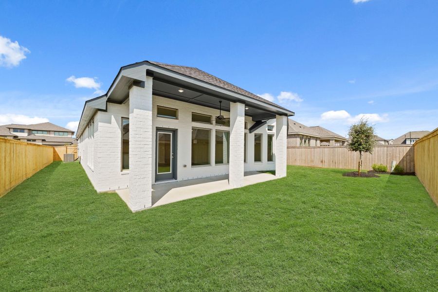 Front exterior of a new home in Bridgeland 55', Cypress, TX, highlighting curb appeal (Image 16). Front exterior of a new home in Bridgeland 55', Cypress, TX, highlighting curb appeal (Image 16).