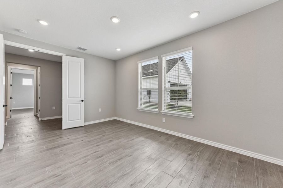 Empty room featuring recessed lighting and light wood-style flooring Empty room featuring recessed lighting and light wood-style flooring