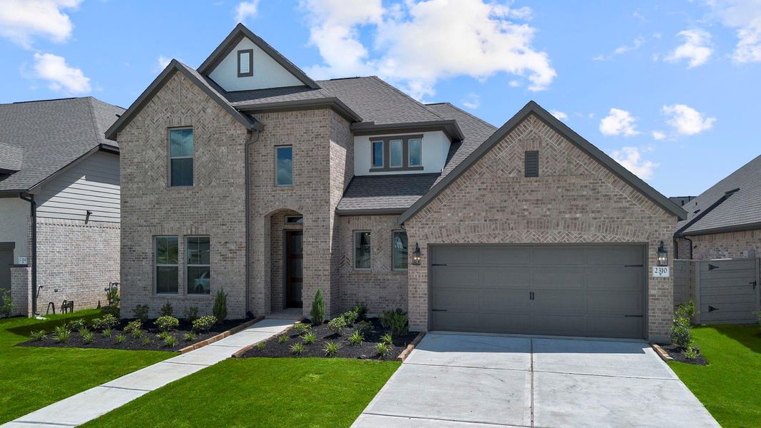 Front exterior of a new home in Pomona 60', Manvel, TX, highlighting curb appeal (Image 2). Front exterior of a new home in Pomona 60', Manvel, TX, highlighting curb appeal (Image 2).