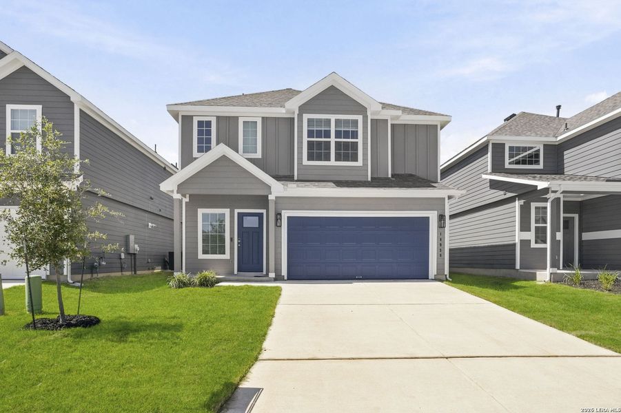 Front exterior of a new home in Timber Creek, San Antonio, TX, highlighting curb appeal (Image 2). Front exterior of a new home in Timber Creek, San Antonio, TX, highlighting curb appeal (Image 2).