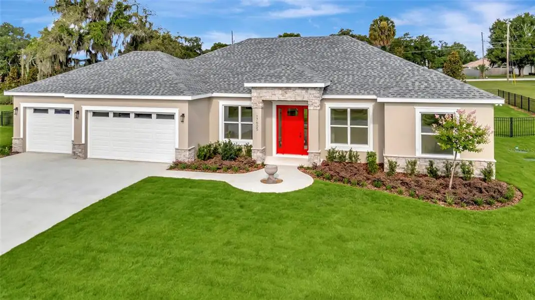 Front exterior of a new home in , Montverde, FL, highlighting curb appeal (Image 1). Front exterior of a new home in , Montverde, FL, highlighting curb appeal (Image 1).