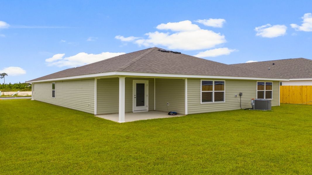 Front exterior of a new home in Park Place, Panama City, FL, highlighting curb appeal (Image 19). Front exterior of a new home in Park Place, Panama City, FL, highlighting curb appeal (Image 19).