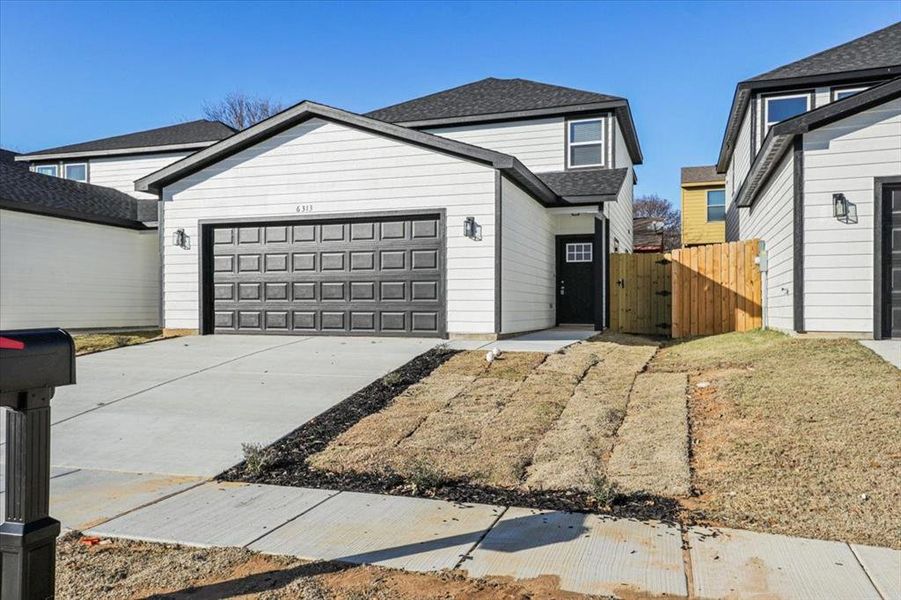 View of front of home featuring a garage